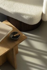 Kaboompics - Calm Reading Corner with Books, Wooden Side Table and Decorative Bowl