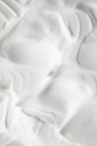 Kaboompics - Soft-Focus White Cream Swirls with Rounded Ridges, Minimal Beauty Texture