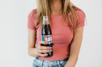 Kaboompics - Young woman with Pepsi Cola bottle