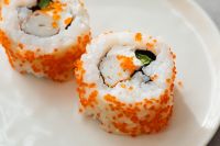 Kaboompics - Tobiko-Coated Maki Sushi Rolls, Close-Up Japanese Food