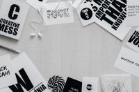 Kaboompics - Top View of Black and White Typography Cards with Earphones and Copy Space