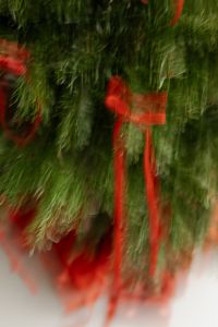 Kaboompics - Close Up Red Ribbon Bow on Christmas Tree with Wrapped Gifts