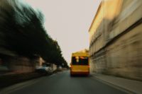 Kaboompics - Yellow Bus on a Motion-Blurry Tree-Lined City Road
