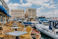 Kaboompics - Outdoor Marina Restaurant Tables With Waterfront Buildings in Naples