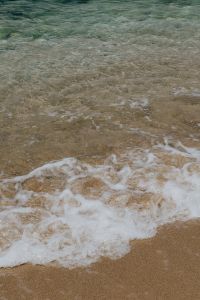 Kaboompics - Clear Shallow Seawater Over Sandy Beach Texture