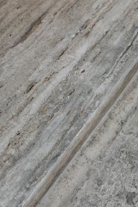 Kaboompics - Weathered Orange Green Stone Wall