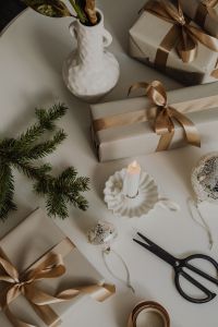 Kaboompics - Minimalist Holiday Decor Flat Lay with Ceramic Vase, Evergreen and Wrapped Gifts