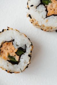 Kaboompics - Macro Close-Up of Sesame-Crusted Maki Sushi with Nori and Rice