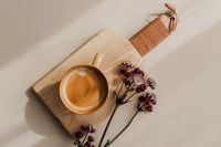 Kaboompics - Overhead Coffee Cup and Astrantia Flowers on a Wooden Serving Board