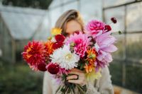 Kaboompics - Woman Partially Hidden By Dahlia Bouquet