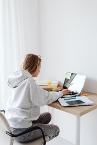 Kaboompics - Teenage Student Working on Laptop at Home Study Desk