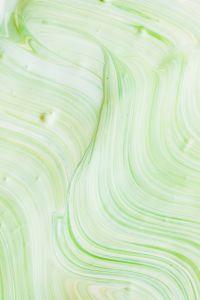 Kaboompics - Light Green Fluid Paint Swirls with Layered Waves for Abstract Texture Backgrounds