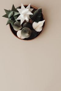 Kaboompics - Beige Christmas Background with Folded Paper Ornaments in a Decorative Bowl