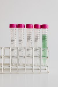 Kaboompics - Pink-Capped Sample Tubes With Green Liquid