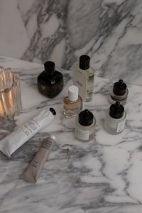 Kaboompics - Serum and Skincare Packaging on Stone Surface