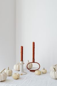 Kaboompics - Minimalist Autumn Candle Arrangement with White Pumpkins and Terracotta Tapers