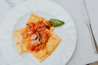 Kaboompics - Ravioli Plate with Tomato Sauce, Parmesan and Table Cutlery