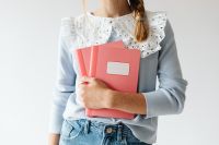 Kaboompics - Student Holding Pink Notebooks and School Supplies