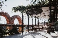 Kaboompics - Restaurant Terrace with Brick Arches and Green Pergola