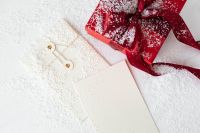 Kaboompics - Holiday Gift Wrapping Flat Lay with a Red Box, Blank Card and Gift Tags
