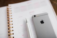 Kaboompics - Blurred Pink Calendar and Smartphone with Silver Pen, Shallow Depth of Field