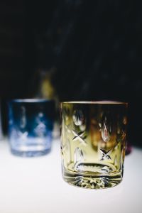 Kaboompics - Blue and Amber Cut Crystal Tumblers on Display