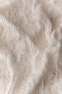 Kaboompics - Soft Cream Knitwear Texture With Raised Pattern