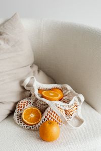 Kaboompics - Close-Up of Fresh Orange Halves in a Reusable Net Produce Bag
