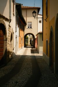 Kaboompics - Cobblestone Passage Between Colorful Italian Houses