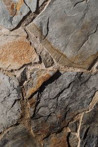 Kaboompics - Shadowed Dark Stone Wall Texture
