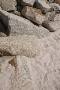 Kaboompics - Granite Rocks and Sandy Beach Texture