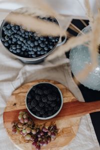 Kaboompics - Overhead Berry Bowls and Grapes With Pampas Grass