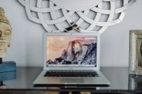 Kaboompics - Silver Apple MacBook Pro on a shiny table