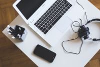 Kaboompics - White laptop with smartphone and headphones