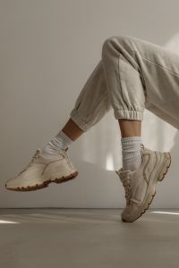 Kaboompics - Neutral Athleisure Outfit with Sneakers in Motion