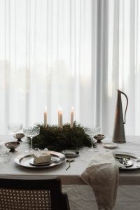 Kaboompics - Centered Advent Wreath with Four Lit White Candles on White Table