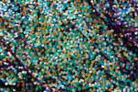 Kaboompics - Teal and Green Sequin Bokeh with Dark Blue Edges, Abstract Textile Background