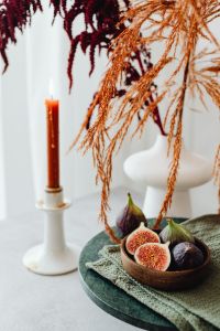 Kaboompics - Fresh Fig Bowl With Candle And Dried Branches
