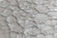 Kaboompics - Macro Glass Texture with Layered Irregular Facets in Neutral Gray