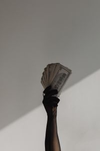 Kaboompics - Dollar Bills and Red Bow Minimal Flat Lay