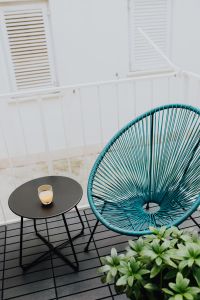 Kaboompics - A stylish garden chair and a small table on the balcony