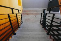 Kaboompics - Staircase by a yellow wall