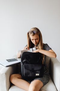 Kaboompics - Student Packing Backpack beside Notebook