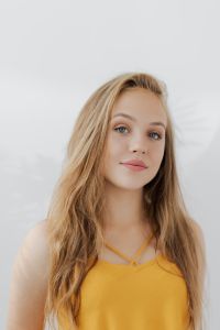 Kaboompics - Three-Quarter Blonde Teen Portrait in Mustard Top