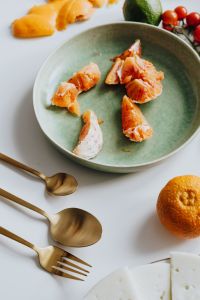 Kaboompics - Orange on a White Plate