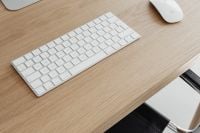 Kaboompics - Close-Up White Keyboard and Mouse on Oak Desk with Copy Space