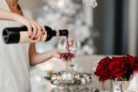 Kaboompics - Woman Pouring Red Wine into a Glass at Christmas Dinner
