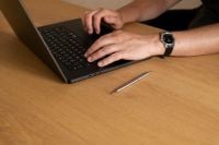 Kaboompics - Close-Up of Laptop and Hands in a Home Office