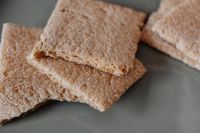 Kaboompics - Stacked Whole-Grain Crispbread in Close-Up, Minimal Healthy Snack Food Background
