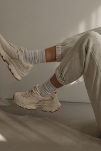 Kaboompics - White Joggers and Chunky Sneakers in Soft Light